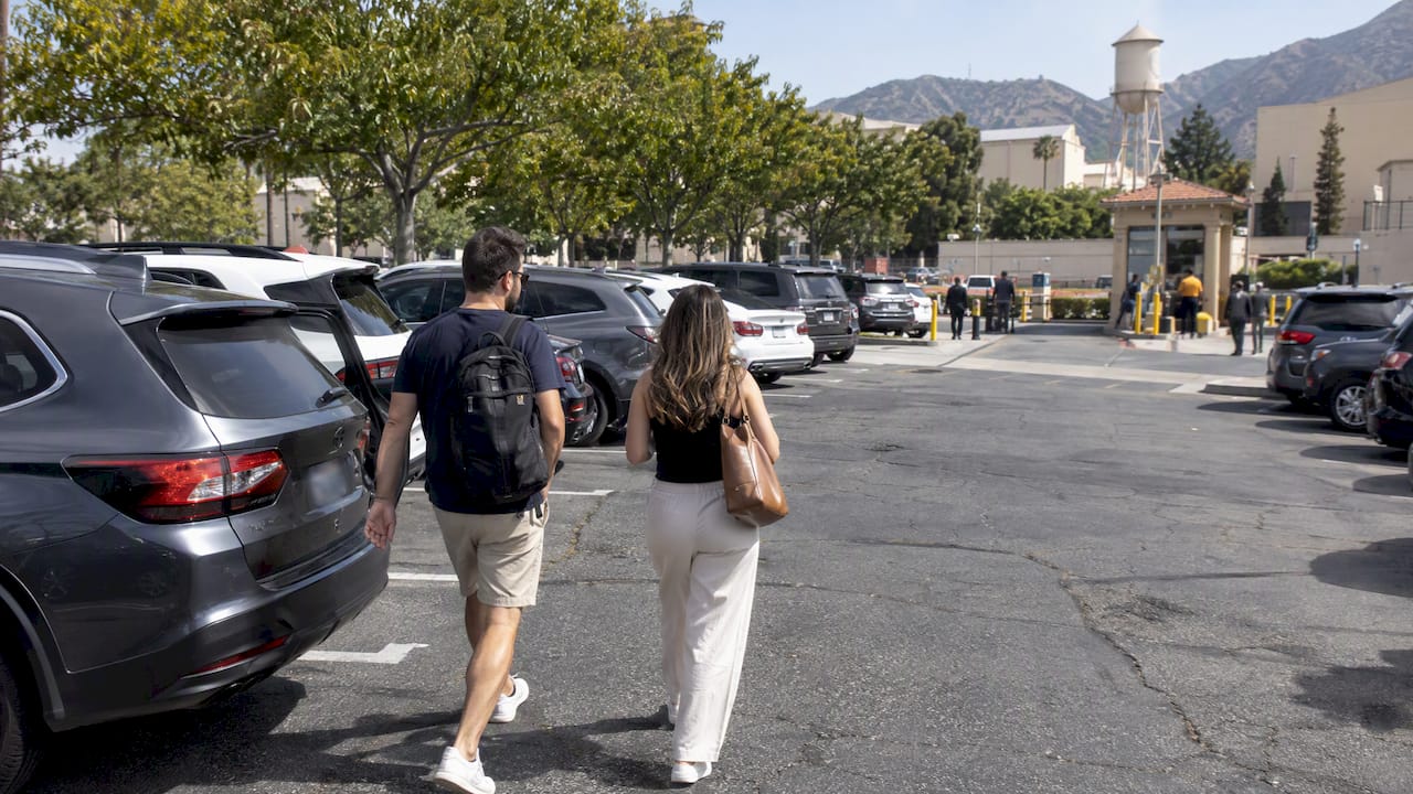 Visitors arriving at the Warner Bros. parking lot